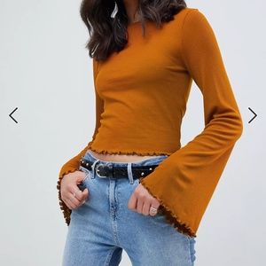 ASOS DESIGN wide sleeve top in rib with lettuce hem detail